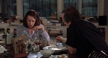Movie still from “Wolf” (1994), directed by Mike Nichols – A man and a woman sitting at a dinner table; Medium shot, Over the shoulder angle