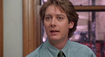 Movie still from “Wolf” (1994), directed by Mike Nichols – A person wearing a shirt and a tie; Close Up shot, Over the shoulder angle