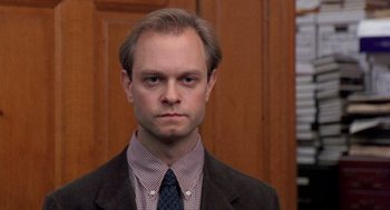 Movie still from “Wolf” (1994), directed by Mike Nichols – A person wearing a suit and tie; Close Up shot, Low angle