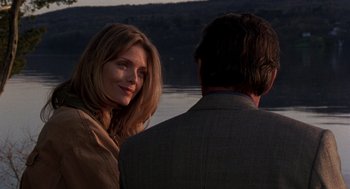 Movie still from “Wolf” (1994), directed by Mike Nichols – A man and a woman standing next to a body of water; Close Up shot, Over the shoulder angle