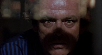 Movie still from “Wolf” (1994), directed by Mike Nichols – A person with green eyes; Close Up shot, Low angle