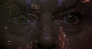 Movie still from “Wolf” (1994), directed by Mike Nichols – The eyes of a person looking out of a window; Extreme Close Up shot, Overhead angle