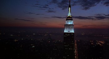 Movie still from “Wolf” (1994), directed by Mike Nichols – The empire state building is lit up at night; Extreme Wide shot, Low angle