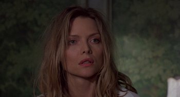 Movie still from “Wolf” (1994), directed by Mike Nichols – A person with long blonde hair; Close Up shot, Low angle