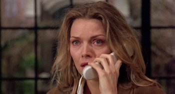 Movie still from “Wolf” (1994), directed by Mike Nichols – A person talking on a cell phone; Close Up shot, High angle