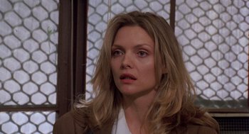 Movie still from “Wolf” (1994), directed by Mike Nichols – A person with long blonde hair; Close Up shot, Over the shoulder angle