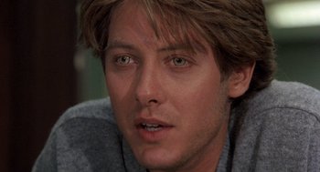 Movie still from “Wolf” (1994), directed by Mike Nichols – A person wearing a sweater; Close Up shot, Over the shoulder angle