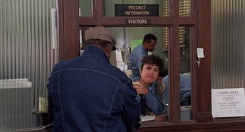 Movie still from “Wolf” (1994), directed by Mike Nichols – A man and a woman looking in a mirror; Medium shot, Over the shoulder angle