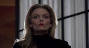 Movie still from “Wolf” (1994), directed by Mike Nichols – A woman in a black top looking at the camera; Close Up shot, Low angle