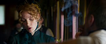 Movie still from “Woman Walks Ahead” (2017), directed by Susanna White – A woman sitting in front of a mirror; Close Up shot, Over the shoulder angle