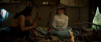 Movie still from “Woman Walks Ahead” (2017), directed by Susanna White – A man and a woman sitting in a tent; Medium shot, Over the shoulder angle