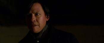 Movie still from “Woman Walks Ahead” (2017), directed by Susanna White – A person wearing a black jacket; Close Up shot, Over the shoulder angle