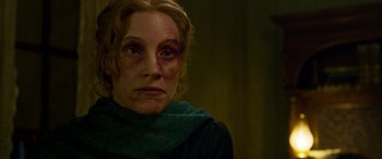 Movie still from “Woman Walks Ahead” (2017), directed by Susanna White – A person with a bruised face; Close Up shot, Over the shoulder angle