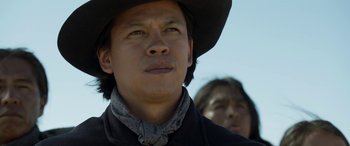 Movie still from “Woman Walks Ahead” (2017), directed by Susanna White – A person wearing a cowboy hat; Close Up shot, Low angle