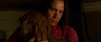 Movie still from “Woman Walks Ahead” (2017), directed by Susanna White – A man in a red shirt is holding a woman; Close Up shot, Over the shoulder angle