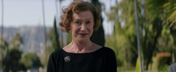 Movie still from “Woman in Gold” (2015), directed by Simon Curtis – An older woman wearing a black dress and a brooch; Close Up shot, Low angle