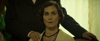 Movie still from “Woman in Gold” (2015), directed by Simon Curtis – A person wearing a suit and a necklace; Close Up shot, Low angle