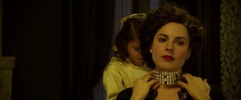 Movie still from “Woman in Gold” (2015), directed by Simon Curtis – A woman is putting a necklace on a young girl; Close Up shot, Over the shoulder angle