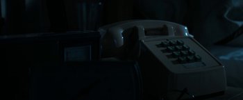 Movie still from “Woman in Gold” (2015), directed by Simon Curtis – A telephone is lit up in a dark room; Extreme Close Up shot, High angle