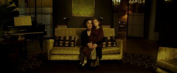 Movie still from “Woman in Gold” (2015), directed by Simon Curtis – A woman and a child sitting on a couch; Medium shot, High angle
