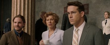 Movie still from “Woman in Gold” (2015), directed by Simon Curtis – A woman and a man in a suit and tie holding a coffee cup; Close Up shot, Over the shoulder angle