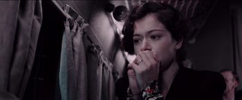 Movie still from “Woman in Gold” (2015), directed by Simon Curtis – A woman is holding her hands to her face; Close Up shot, High angle