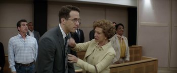 Movie still from “Woman in Gold” (2015), directed by Simon Curtis – An older woman and a younger man in a court room; Medium shot, Over the shoulder angle