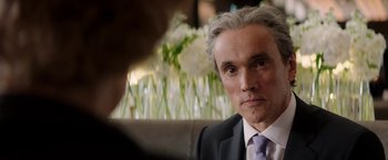 Movie still from “Woman in Gold” (2015), directed by Simon Curtis – A man in a suit and tie looking at the camera; Close Up shot, Over the shoulder angle