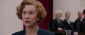 Movie still from “Woman in Gold” (2015), directed by Simon Curtis – An older woman is looking to her left; Close Up shot, Over the shoulder angle