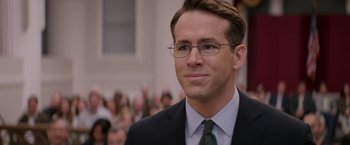 Movie still from “Woman in Gold” (2015), directed by Simon Curtis – A person wearing a suit and glasses; Close Up shot, Over the shoulder angle