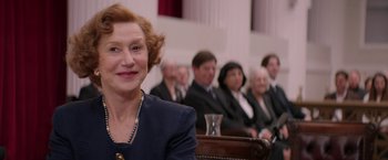 Movie still from “Woman in Gold” (2015), directed by Simon Curtis – An older woman sitting in front of a group of older people; Close Up shot, Over the shoulder angle