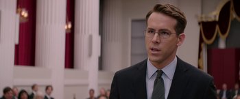 Movie still from “Woman in Gold” (2015), directed by Simon Curtis – A person wearing a suit and glasses; Close Up shot, Over the shoulder angle