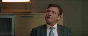 Movie still from “Woman in Gold” (2015), directed by Simon Curtis – A person wearing a suit and tie; Close Up shot, Over the shoulder angle