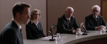 Movie still from “Woman in Gold” (2015), directed by Simon Curtis – A man and a woman sitting in front of microphones; Medium shot, Over the shoulder angle