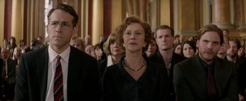 Movie still from “Woman in Gold” (2015), directed by Simon Curtis – A group of people standing in a room; Medium shot, Low angle