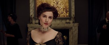 Movie still from “Woman in Gold” (2015), directed by Simon Curtis – A woman in a black dress with a diamond necklace; Close Up shot, Over the shoulder angle