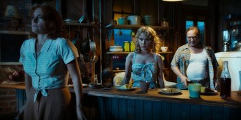 Movie still from “Wonder Wheel” (2017), directed by Woody Allen – A woman standing at a counter in a kitchen; Medium shot, Low angle