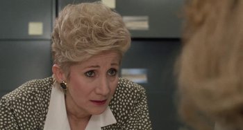 Movie still from “Working Girl” (1988), directed by Mike Nichols – An older woman sitting in front of a mirror; Close Up shot, Over the shoulder angle