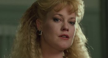 Movie still from “Working Girl” (1988), directed by Mike Nichols – A person with blonde hair; Close Up shot, Low angle