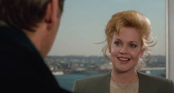 Movie still from “Working Girl” (1988), directed by Mike Nichols – A man and a woman talking to each other; Close Up shot, Over the shoulder angle
