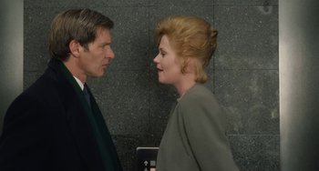 Movie still from “Working Girl” (1988), directed by Mike Nichols – A man and a woman talking to each other; Close Up shot, Over the shoulder angle