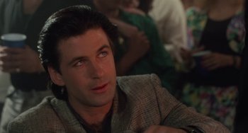 Movie still from “Working Girl” (1988), directed by Mike Nichols – A person wearing a jacket; Close Up shot, Over the shoulder angle