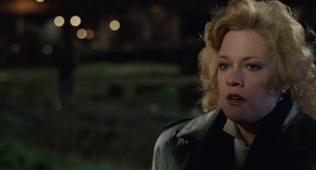 Movie still from “Working Girl” (1988), directed by Mike Nichols – A person wearing a jacket; Close Up shot, Over the shoulder angle