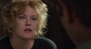 Movie still from “Working Girl” (1988), directed by Mike Nichols – A person with blonde hair; Close Up shot, Over the shoulder angle