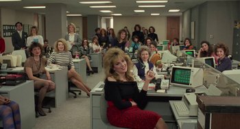 Movie still from “Working Girl” (1988), directed by Mike Nichols – A group of women sitting in an office with computers; Wide shot, High angle