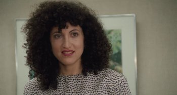 Movie still from “Working Girl” (1988), directed by Mike Nichols – A person with a curly hair; Close Up shot, Over the shoulder angle