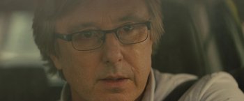 Movie still from “Wrong Turn” (2021), directed by Mike P. Nelson – A person wearing glasses; Close Up shot, Over the shoulder angle