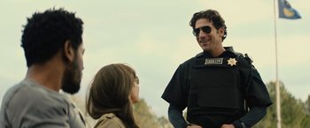 Movie still from “Wrong Turn” (2021), directed by Mike P. Nelson – A man and a woman talking to each other outside; Medium shot, Over the shoulder angle