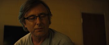 Movie still from “Wrong Turn” (2021), directed by Mike P. Nelson – A person wearing glasses; Close Up shot, Low angle