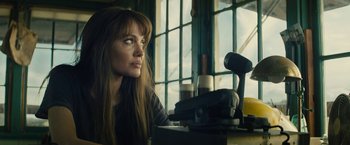 Movie still from “Wrong Turn” (2021), directed by Mike P. Nelson – A woman sitting in front of a window looking off into the distance; Close Up shot, Low angle